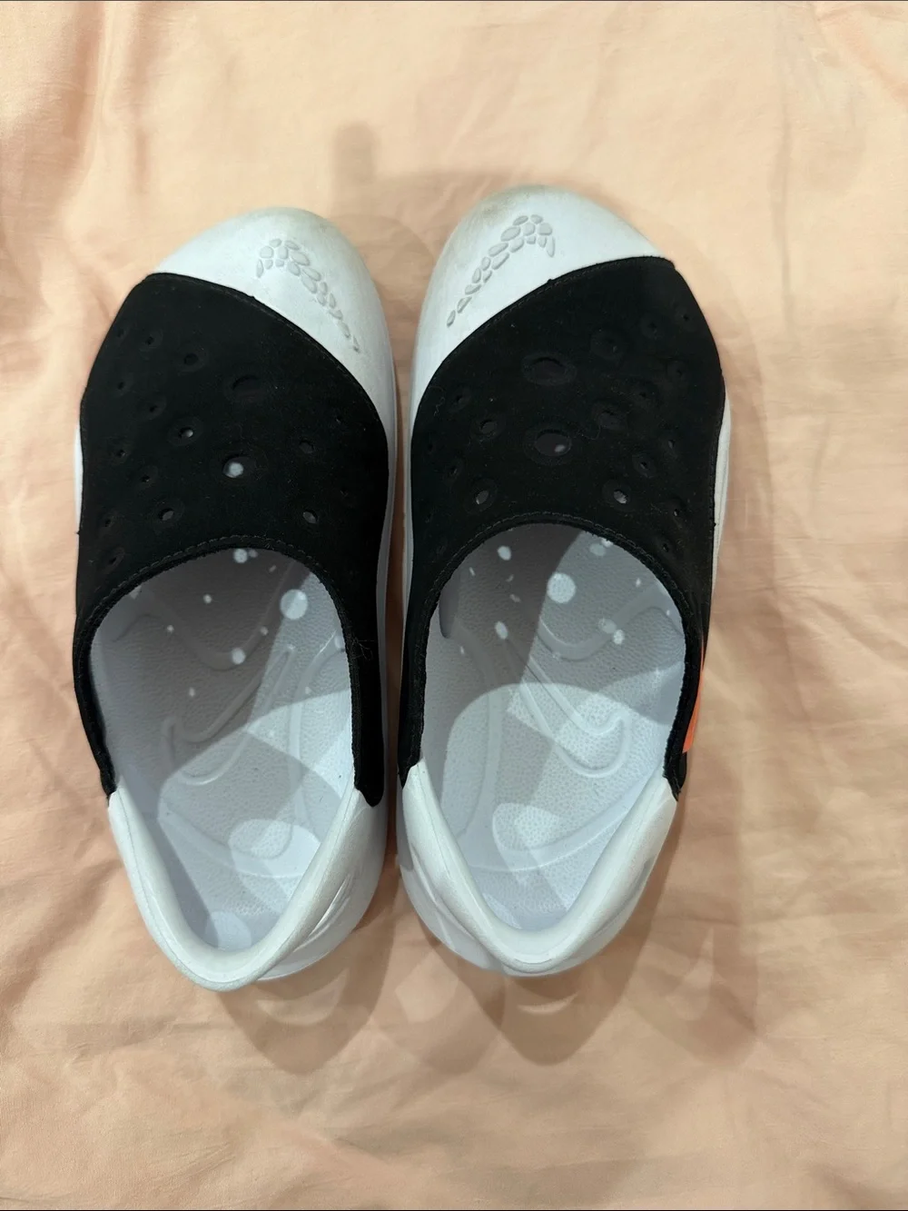 Nike Black and White Slip-On Clogs with Orange Accent
